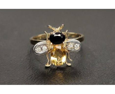 CITRINE, SAPPHIRE AND DIAMOND BEE DESIGN RINGthe body formed by an oval cut citrine and the head by an oval cut sapphire, the