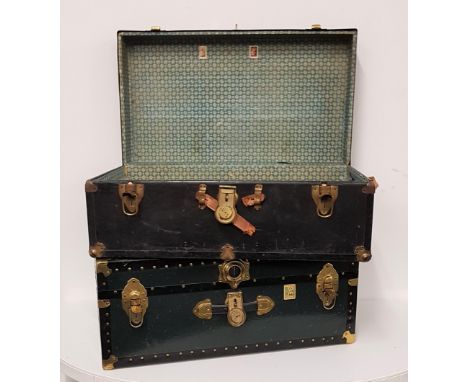 TWO VINTAGE TRAVEL TRUNKSboth with reinforced corners, side carry handle and brass locks, 33cm x 78cm x 42.5cm (2) 