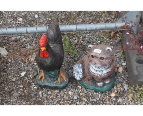 Two garden ornaments in the form of a cockerel and a cat