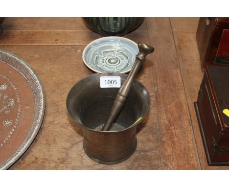 A Bell metal pestle and mortar