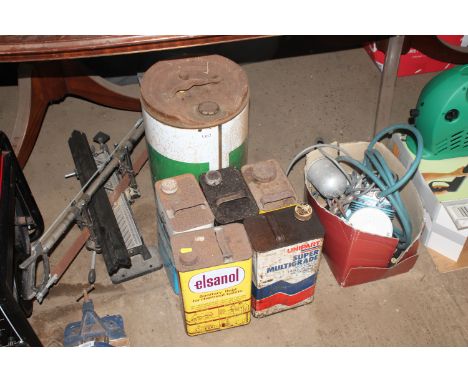 A tin of Agri Castrol multi use oil (part full) and five other tins