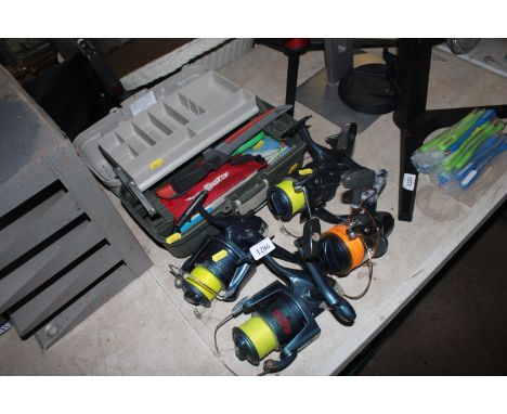 Four sea fishing reels and a tackle box containing a filleting knife, various fishing rigs etc. This item can only be purchas