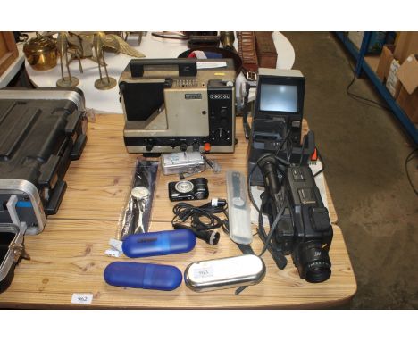 A Eumig projector sold as collectors item, a Canon camcorder, Nikon camera, various wrist watches, sold as seen