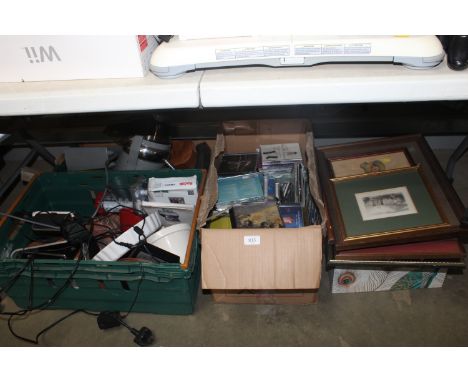 Four boxes containing various CDs, kitchenalia, radios and prints etc 