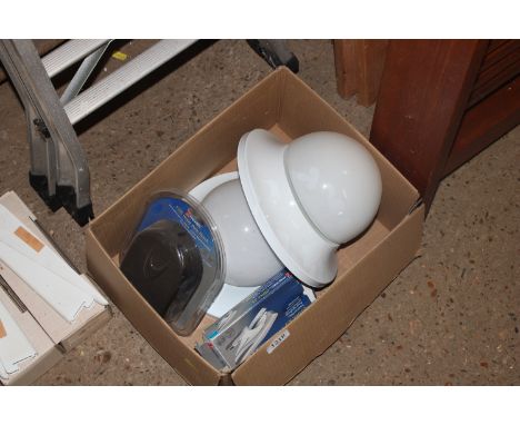 Two light fittings; a hole punch and a stapler