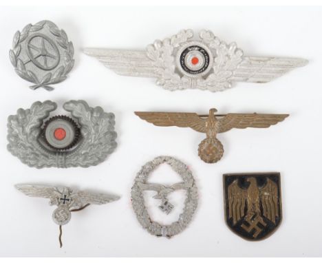 Selection of Third Reich Metal Insignia, including a Luftwaffe NCO’s cap wreath, German army cap wreath, summer pattern remov