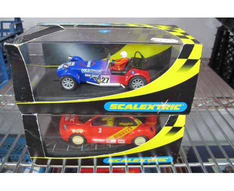 Two Scalextric 1:32nd Scale Slot cars, #C.2201 Caterham 7, #C2233 VW Beetle Pirelli No. 3, both cased.