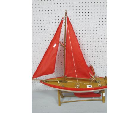A Nauticalia (Shepperton-On-Thames) Wooden Model Pond Yacht, measuring approximately 56cm long, 60cm high, signs of wear/pain