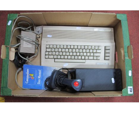 A Commodore 64 (C64) Personal Computer, (untested), joystick user manual, ten assorted format games on cassette to include El