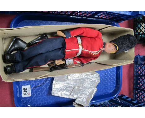 A Palitoy Circa 1960's Action Man, moulded blonde hair, brown eyes, scar to cheek, wearing a Grenadier Guards uniform with be