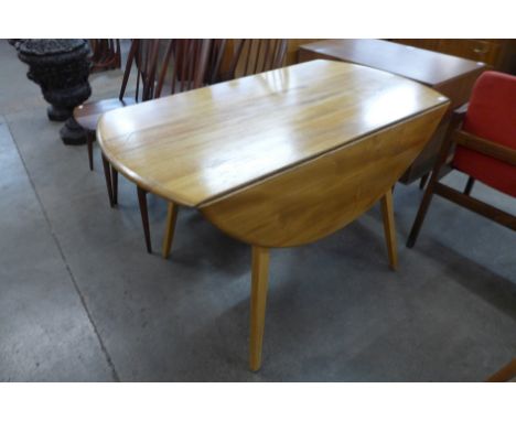 An Ercol Blonde elm and beech Windsor drop-leaf table 