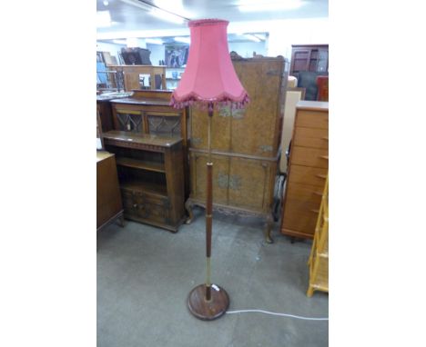 A teak standard lamp 