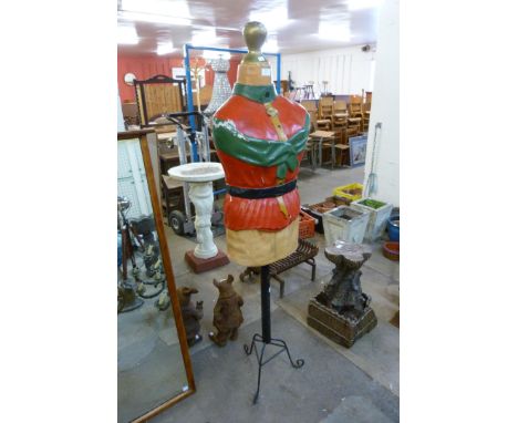 A painted figure glass mannequin on stand 