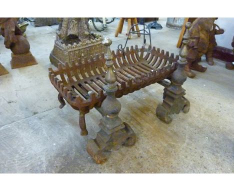 A Victorian cast iron fire grate and andirons 