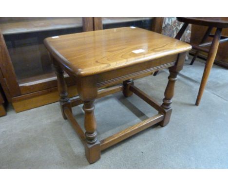 An Ercol Golden Dawn elm stool 