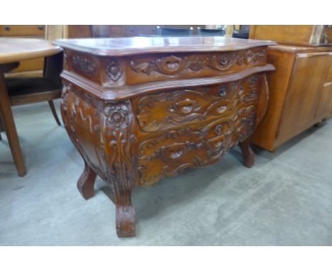 A Dutch style hardwood bombe shaped commode 