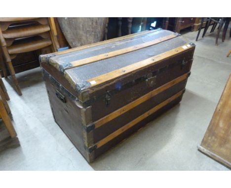 An early 20th Century dome topped steamer trunk 