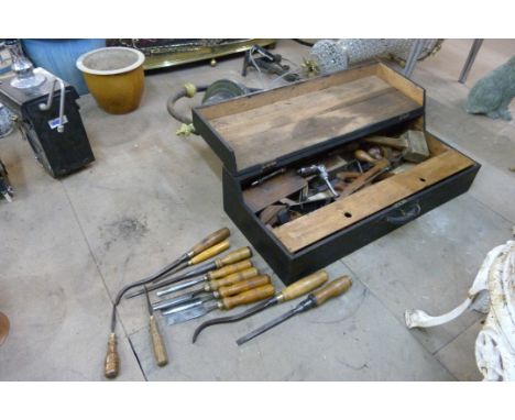 A wooden carpenter's tool chest, including tools 