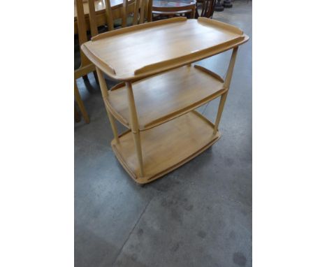 An Ercol Blonde elm and beech Windsor trolley 