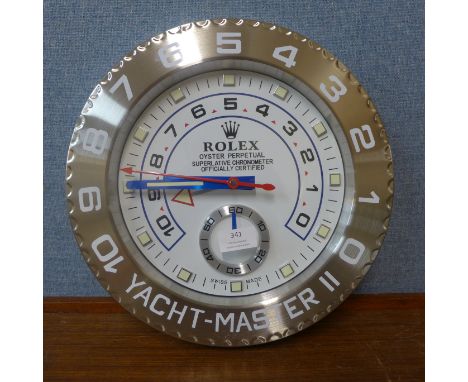 A Rolex style dealer's display wall clock 