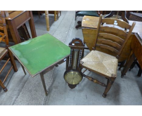 An oak aneroid barometer, a folding card table and a chair 