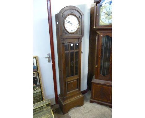 An early 20th Century carved oak longcase clock 