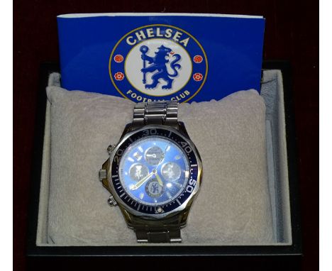 A Danbury Mint 'Chelsea Double Winners 2009/2010' chronograph wrist watch (with CofA), two glass paperweights, a Burberrys co