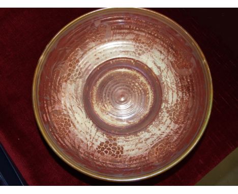 A Pilkington Royal Lancastrian lustre bowl, internally decorated with bunches of grapes by Gwladys Rodgers, printed and impre