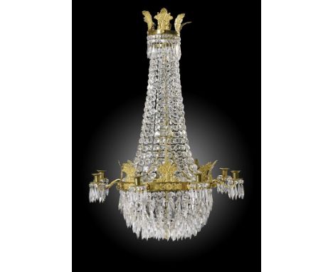 A French Empire ormolu and cut crystal chandelier, the corona with applied palmettes and leaves with chains of drops descendi