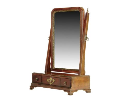 A George II walnut dressing table mirror, with a bevelled arched plate within a moulded gilt slip, the box base with a caddy 