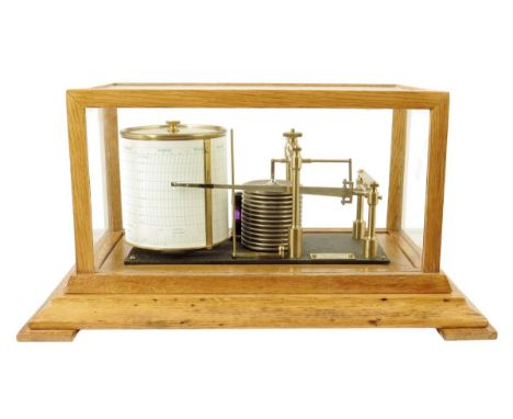 An oak barograph by Negretti & Zambra, no. R/45190, the thirteen aneroid movement flanking the recording drum, the glazed cas