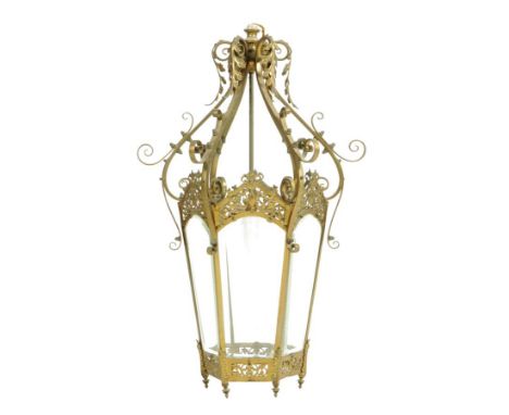 A Victorian gilt brass hall lantern, with scroll arms above a tapering hexagonal body with bevelled glass panels, stamped 'RD