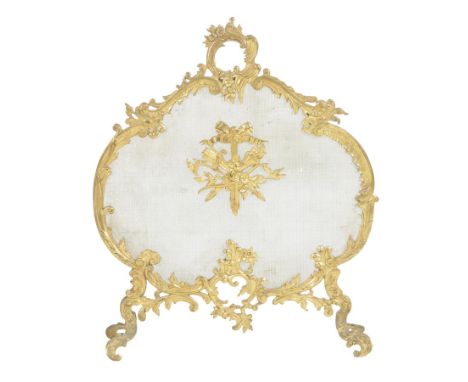 A late 19th century  French gilt brass firescreen, in Rococo style, the mesh guard with applied ribbon tied war trophies, 78.