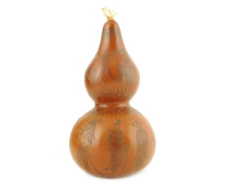 λ A 19th century French sailor's double gourd scrimshaw, with a carved marine ivory bird finial above finely engraved portrai