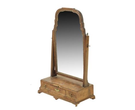 A George II walnut dressing table mirror, the arched plate with a carved gilt slip within a moulded frame, the box base with 