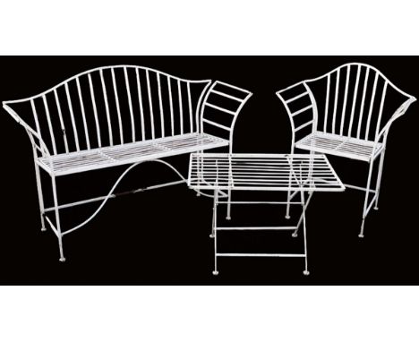 A white painted wrought iron garden seat in Regency style, with a serpentine back and scroll arms, together with a matching a