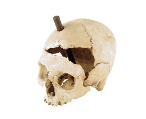 An early female skull, with a contemporary wound to her cranium and with an iron stake discovered with the skull, together wi