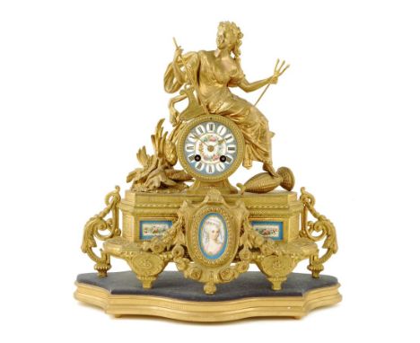 A French porcelain and gilt spelter mantel clock, the striking movement numbered '265' in a drum case surmounted by a seated 