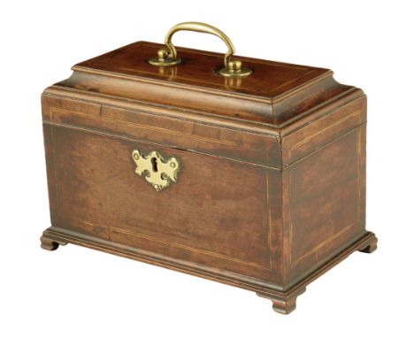 A George II walnut tea caddy, inlaid with stringing, the hinged lid with a raised moulded edge and a brass handle, with a div