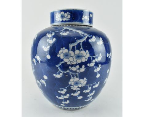 A large Qing dynasty blue and white prunus ginger jar with lid. Four character Kangxi Nian Zhi mark to base. Restoration and 