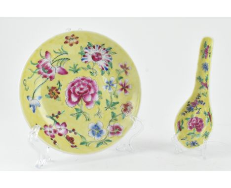 A 20th century yellow-ground famille rose dish and spoon set. The set depicting a scene of lotus, peonies, plum blossoms to t