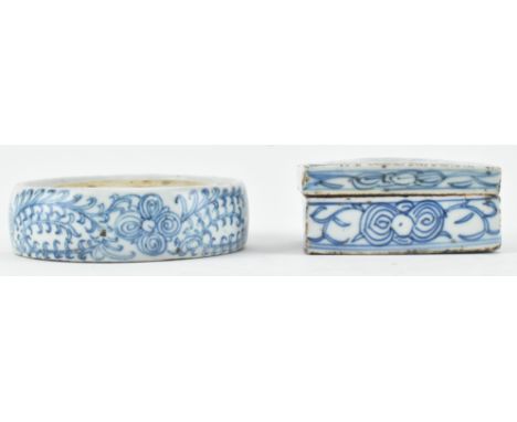 A Qing dynasty blue and white inkwell and a seal paste box. The inkwell decorated with flower and foliage and the seal paste 