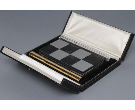 A LIMITED EDITION SILVER TRAVELLING CHESS SET, maker Cyril Endfield, London 1972, commemorating the Spassky - Fischer World C