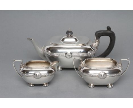 AN EDWARDIAN BACHELOR'S THREE PIECE SILVER TEA SERVICE, maker's mark HM, Birmingham 1908, of rounded flared oblong form with 