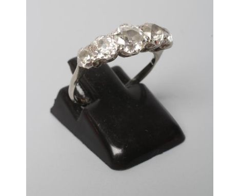 A FIVE STONE DIAMOND RING, the old cut stones claw set to a plain white shank, stamped ?CTW, PT, size K (Est. plus 21% premiu