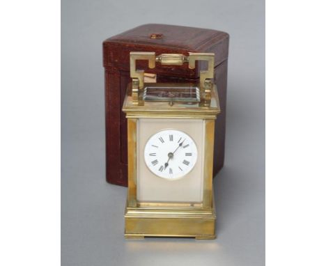 A FRENCH BRASS CASED CARRIAGE CLOCK, the twin barrel repeater movement with platform escapement striking on a gong, white met