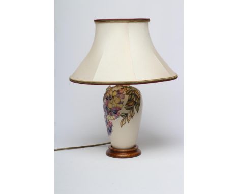 A MOORCROFT POTTERY WISTERIA PATTERN TABLE LAMP BASE, modern, of slender ovoid form, tubelined and painted in shades of yello