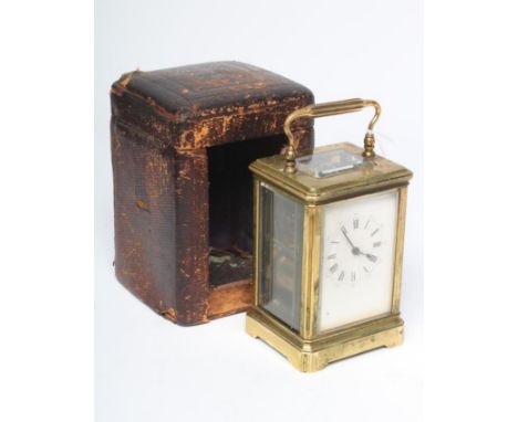 A BRASS CASED CARRIAGE CLOCK, the twin barrel movement with platform escapement striking on a gong, white enamel dial with Ro