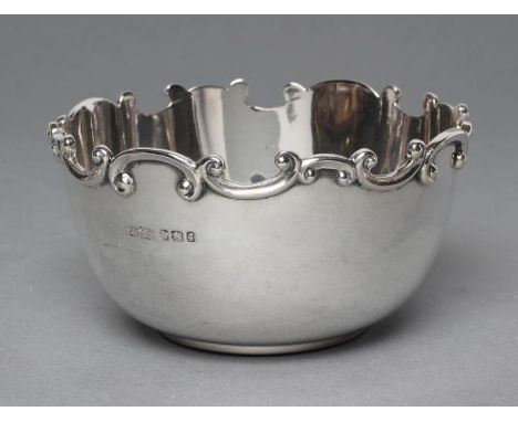 A LATE VICTORIAN SILVER SUGAR BOWL, maker's mark J D & S, Sheffield 1899, with cast and applied undulating scroll rim, 3 3/4"