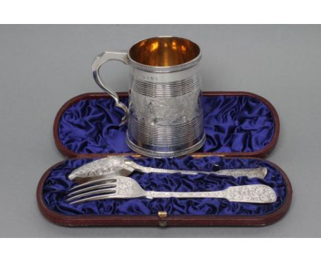 A LATE GEORGE III SILVER CHRISTENING MUG, maker's mark rubbed, London 1811, of plain tapering cylindrical form with double "C